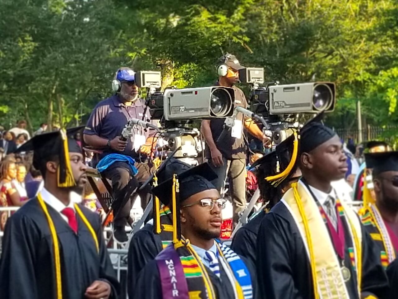 camera crew operating two cameras at graduation ceremony